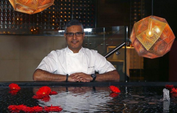Chef Atul Kochhar, the first Indian chef to receive a Michelin star, poses at his Benares restaurant in Mayfair, central London January 21, 2015. REUTERS/Eddie Keogh
